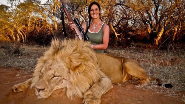 Melissa Bachman with the lion she killed in Africa.