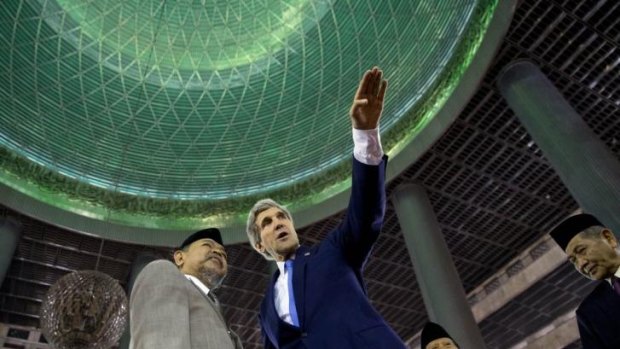 John Kerry, right, tours the Istiqlal Mosque in Jakarta with Grand Imam K.H. Ali Mustafa Yaqub.