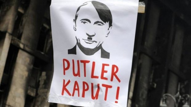Prince Charles is not alone: Russian President Vladimir Putin is depicted as Hitler at a demonstration in Kiev.