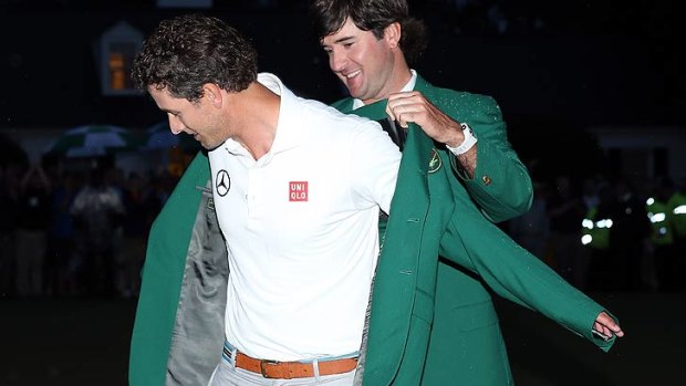 Adam Scott tries on teh green jacket for the first time.