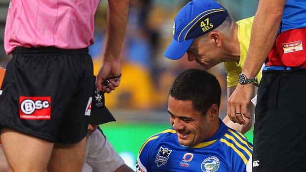 Jarryd Hayne of the Eels is helped on to a stretcher during the round two clash against the Warriors.