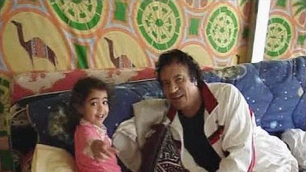 Ousted Libyan dictator Muammar Gaddafi was filmed playing with his grandchildren inside his trademark tent.