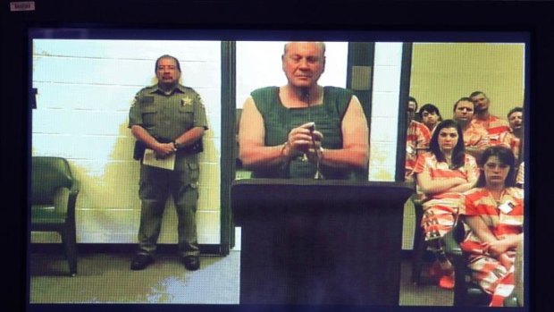 Curtis Reeves appears via video conference after being charged with murder over a theatre shooting in Florida.