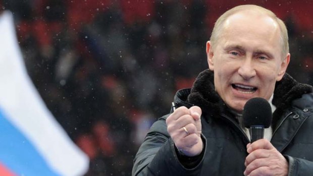 Boisterous ... Vladmir Putin addresses a crowd of 130,000 at Luzhniki Stadium in Moscow. Mr Putin has cast the anti-government movement as a US-backed attempt to undermine him.