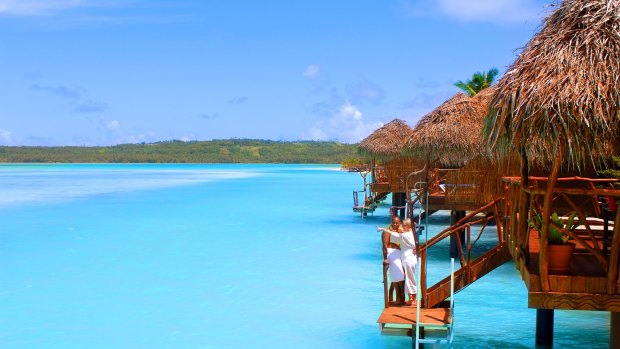 An over-water daytime bungalow at Aitutaki Lagoon Resort & Spa.