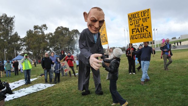 A large puppet in the likeness of Prime Minister Tony Abbott, complete with pants on fire, was a major draw card at the 'bust the budget' rally.
