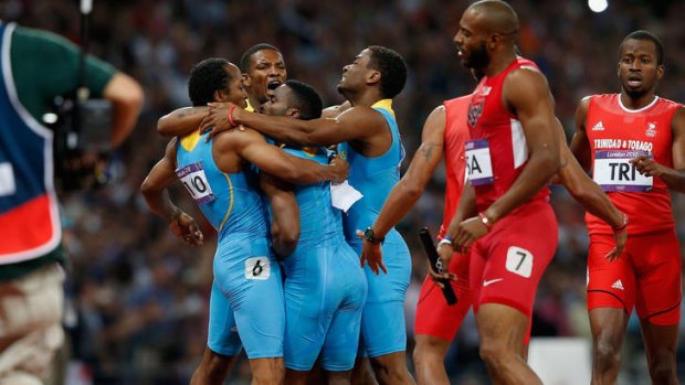 Winners ... runners from the Bahamas celebrate after winning the men's 4x400m relay.