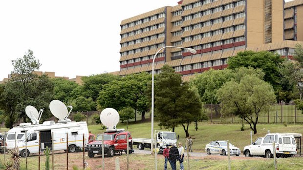 Broadcast vans parked near the hospital where South Africa's former President Nelson Mandela is hospitalised.