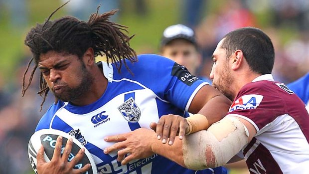 Jamal Idris tries to break through the Manly defence.