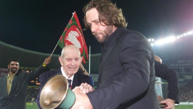 Historic moment: Russell Crowe and the oldest surviving Rabbitohs player at the time, Albert Clift, ring the bell in 2002.