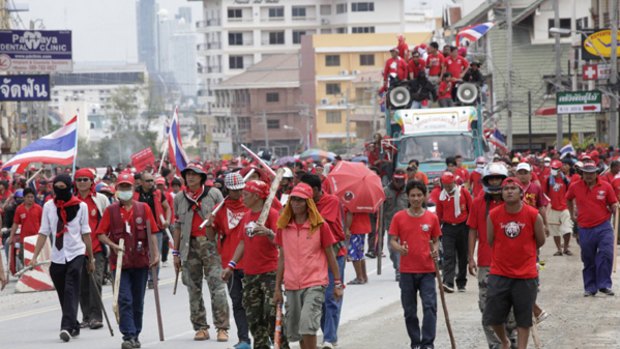Red-shirted supporters of ousted Thai prime minister Thaksin Shinawatra march along a road near the venue of the 14th ASEAN Summit and Related Summits in Pattaya.