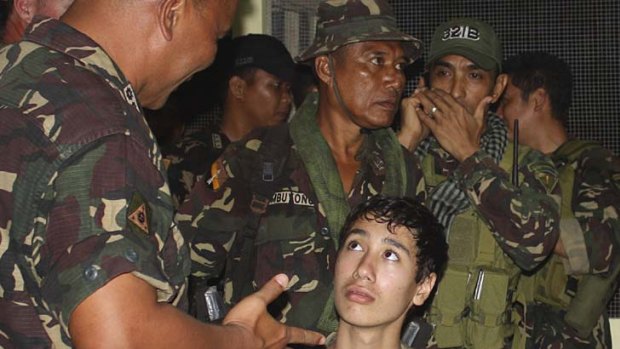 In safe hands ... Kevin Lunsmann talks to Filipino soldiers.