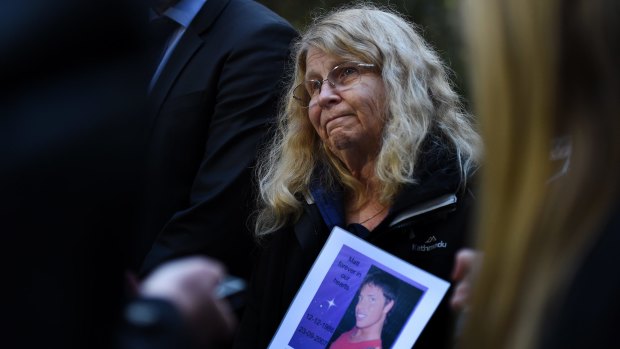 Faye Leveson holds a photo of her son Matthew Leveson during a press conference on Thursday.