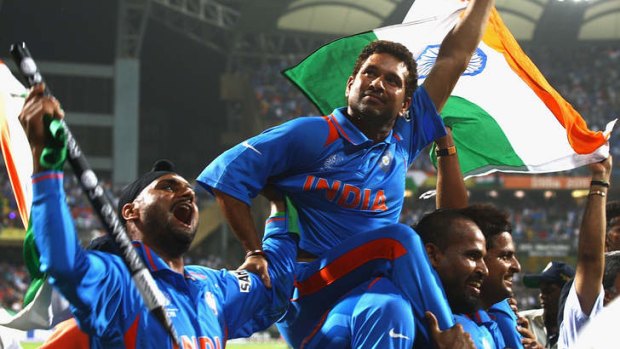 Harbhajan Singh and Sachin Tendulkar celebrate winning the 2011 ICC World Cup in Mumbai.