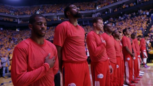 Seeing red: The LA Clippers stage their protest.