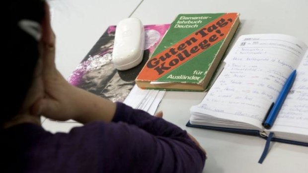 A student at a German language course for foreigners at a language school in Berlin, Germany.