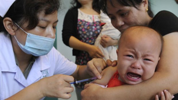 Growth stunted ...  a child wails while being vaccinated against measles at a clinic in Hefei, Anhui province. Population advisers say an end to the policy is inevitable.