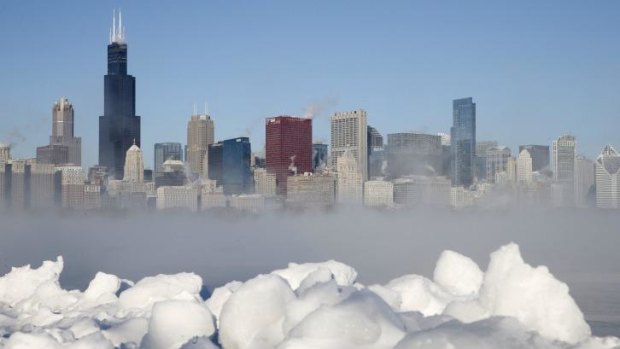The Chicago skyline is seen beyond the arctic sea smoke rising off Lake Michigan.