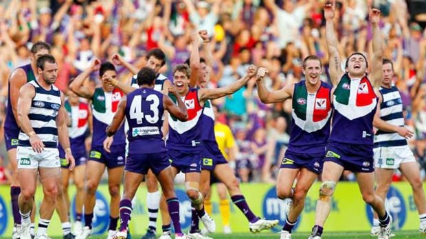 Fremantle players show their delight, and Geelong players their disappointment, as the siren sounds to end yesterday's thrilling shoot-out at Subiaco Oval, which left  the Dockers 3-0 and the Cats 2-1.