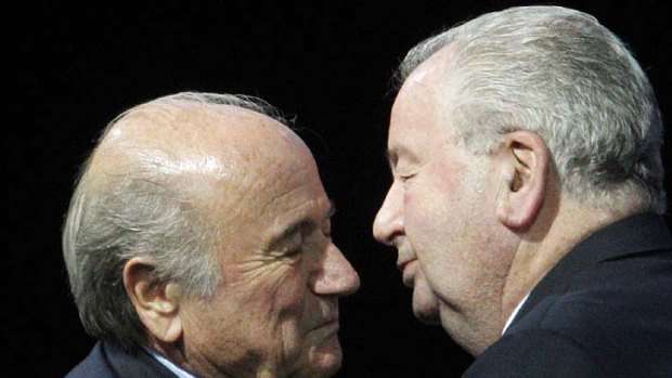 Astonishing outburst .... FIFA president Sepp Blatter is congratulated by Julio Grondona, right, who lambasted the English FA's bid to have the presidential election postponed.