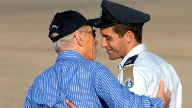 A picture taken on June 25, 2009 shows Israeli Lieutenant Assaf Ramon being congratulated by Israeli President Shimon Peres  on his graduation day in the southern Israeli pilot academy of Hazerim.