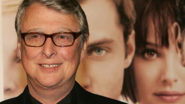 Mike Nichols stands in front of a poster for his 2004 film <i>Closer</i>.