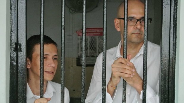 Ferdinant Tjiong (left) and Neil Bantleman, teachers at the newly named 'Jakarta Intercultural School' at the South Jakarta Court to face allegations of sexual assault against students.