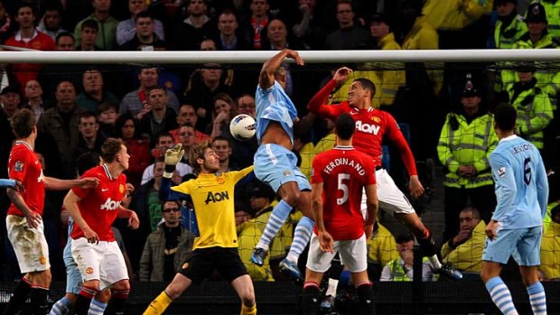 Vincent Kompany of Manchester City scores the crucial goal late in the first half.