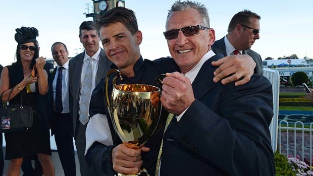 Successful Halls: Nick Hall celebrates his Caulfield Cup win with father Greg.