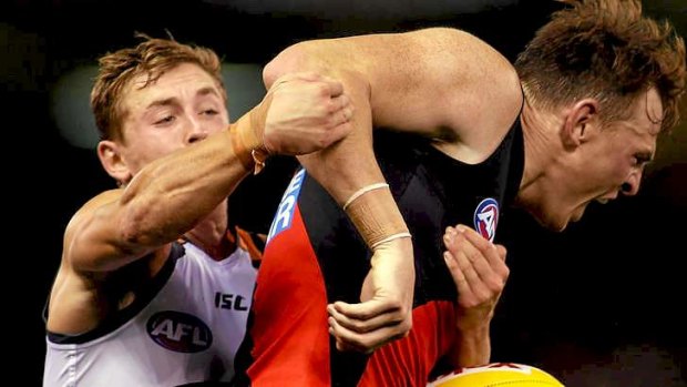 Hands on: Essendon's Brendon Goddard is tackled in the match on Saturday against the Western Sydney Giants at Etihad Stadium.