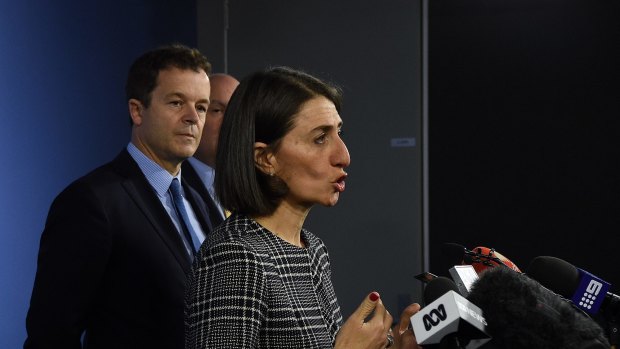 NSW Attorney General Mark Speakman (left), looks on as NSW Premier Gladys Berejiklian speaks at a press conference.