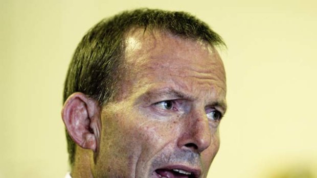 Coward ... Opposition Leader Tony Abbott was called a coward for being overseas when the Senate passed the carbon tax bills.