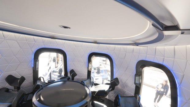 A view inside Blue Origin's crew capsule model with its big windows.