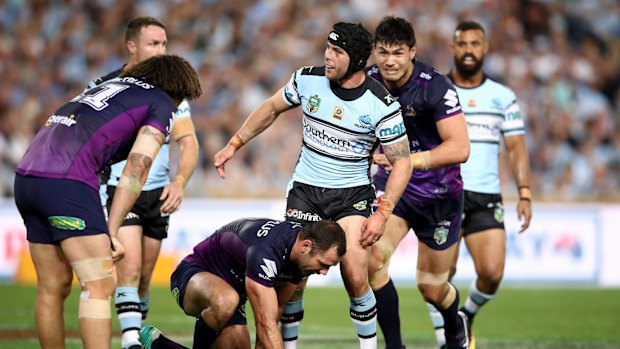 Serial pest: Ennis taunts Cameron Smith after an error in the first half.