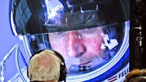 Daredevil ... Felix Baumgartner of Austria is watched on a screen from the mission control centre.