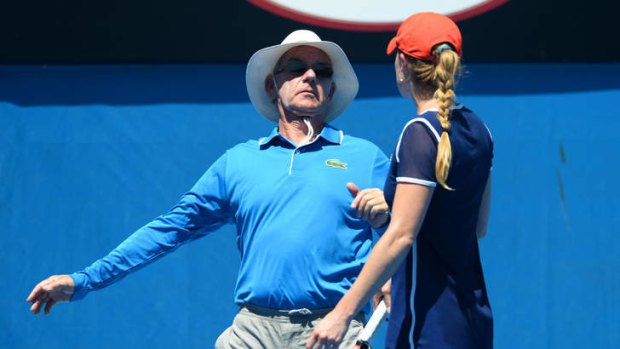 Line of fire: Alize Cornet collides with a line judge at the Australian Open.