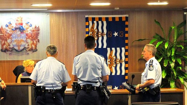 Police arrive at the Brisbane City Council Chambers on Tuesday night to remove Nicole Johnston.