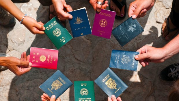 Why is every passport in the world said to feature a varying shade of either red, green, black or blue?