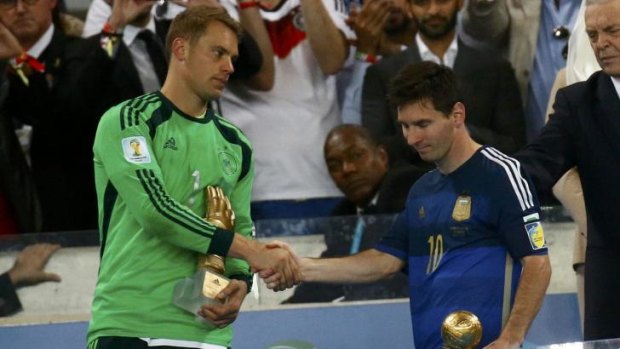 Golden men: Germany’s goalkeeper Manuel Neuer, winner of the Golden Glove for best keeper of the World Cup, with Lionel Messi, named Golden Ball winner as player of the tournament. 