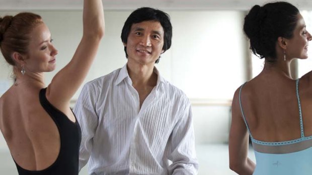"It's very difficult in real life, in the financial world, to see that kind of passion" ... Li Cunxin, pictured with dancers Kathleen Doody and Iona Marques, will be artistic director of the Queensland Ballet.