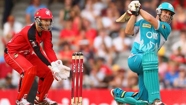 Heat is on: Brisbane's Luke Pomersbach smashes a delivery in the semi-final against the Melbourne Renegades.