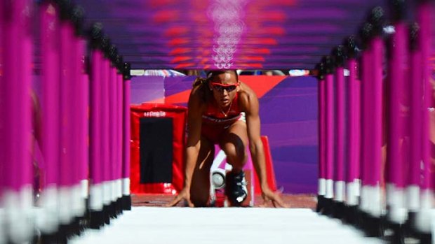 Track queen ... America's LoLo Jones gets ready for the start of the women's 100m hurdles heats.