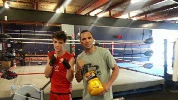 Canberra boxer Adrian Farquhar shapes up with Anthony Mundine.