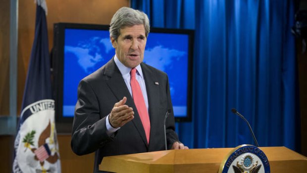 Secretary of State John Kerry gestures during a statement on the ongoing situation in Egypt before the start of a press briefing at the State Department in Washington.