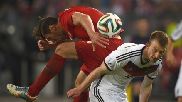 Germany's midfielder Maximilian Arnold (R) and Poland's defender Pawel Olkowski vie for the ball during their 0-0 draw, May 13.
