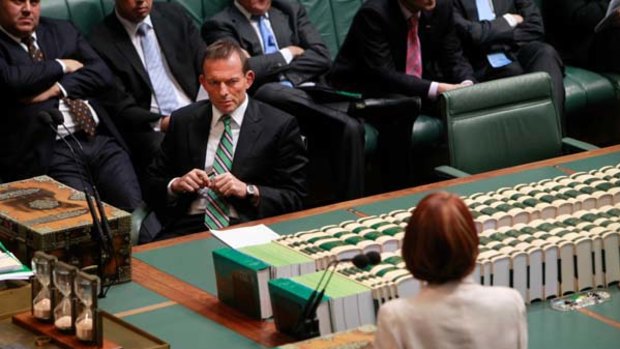 Tony Abbott listens to Julia Gillard after the secret ballot to elect a Deputy Speaker.