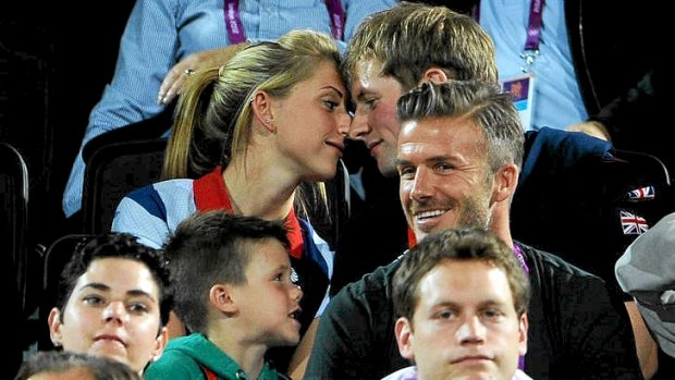 Talk of the tabloids ... British cyclists Laura Trott (left) and Jason Kenny take some attention away from David Beckham during the beach volleyball.