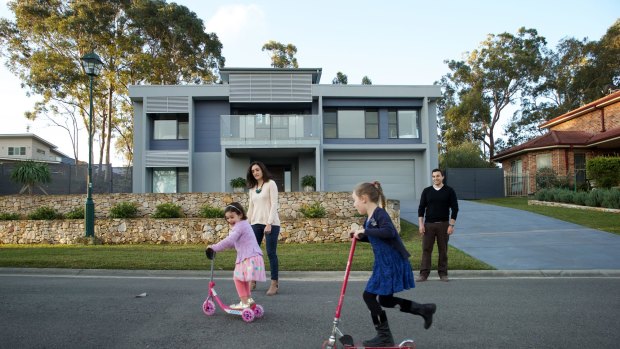 Claire and Josh Lewis and their two girls at their Blue Mountains home, two sides of which has a fire rating of Flame Zone. Their home is built to Flame Zome fire rating on all sides.
3rd September 2015
Photo: Wolter Peeters
The Sydney Morning Herald