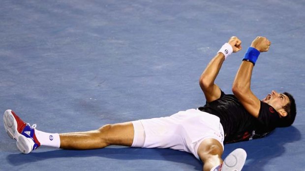 Ecstasy ... Novak Djokovic celebrates winning championship point after nearly six hours against Rafael Nadal, the longest final in major championship history.