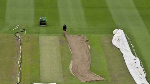 The pitch square at the MCG receives some attention from a  groundsman yesterday as preparations continue for the Boxing Day Test, which begins on Sunday.
